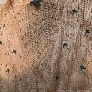 Pink knit top with flower embroidery